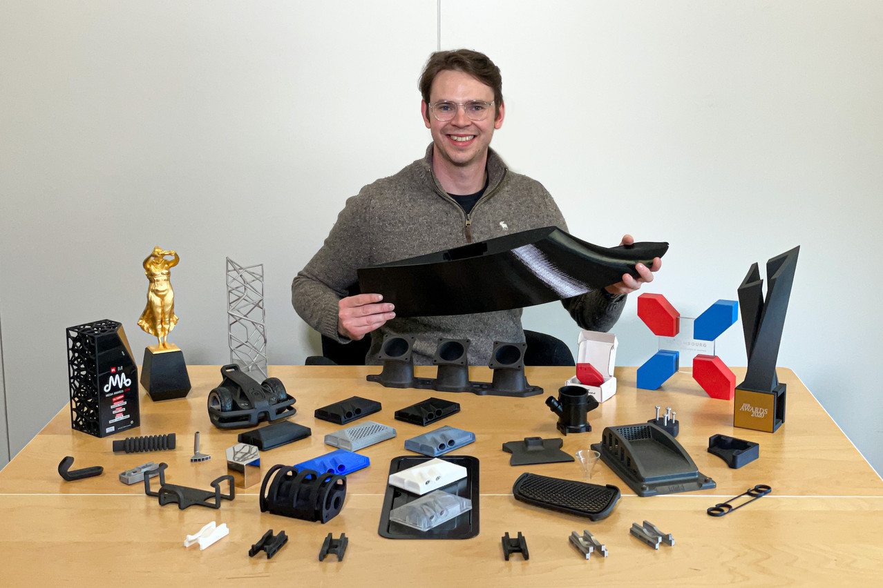 Dean Kauffmann--pictured here with various parts, trophies and models 3D-printed by his firm--took over as CEO of AMSOL, which owns 3Dprint.lu, in 2017. Photo: AMSOL