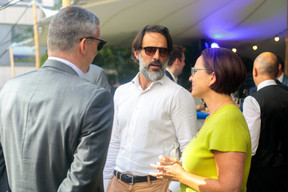 Land journalist Pierre Sorlut speaks with Jonathan Prince and finance minister Yuriko Backes, during the Lhoft 5th anniversary reception, 8 July 2022. Photo: Matic Zorman