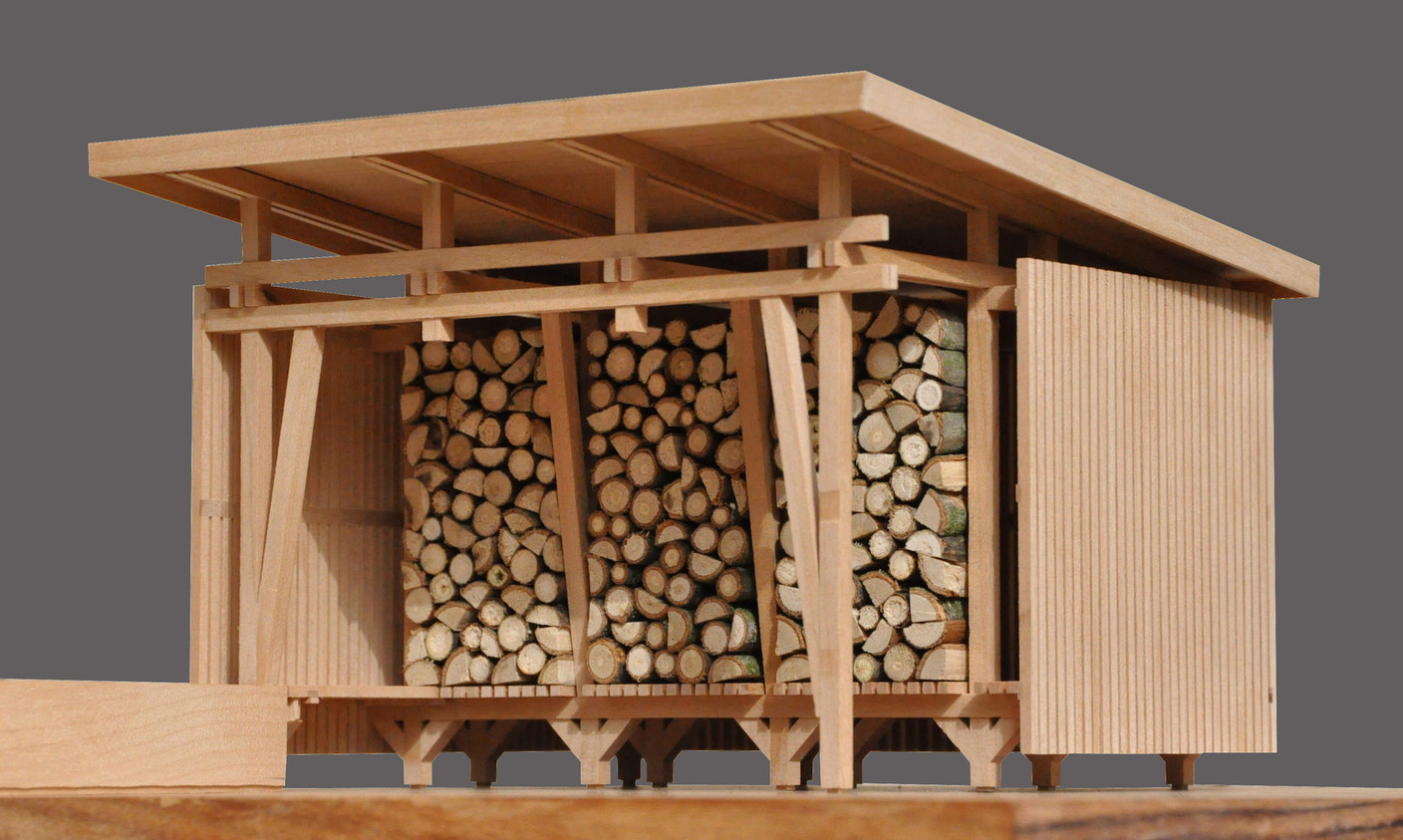 L’abri de jardin permet de stocker 6m 3  de bois. (Photo: Agence d’Architecture Stanislaw Berbec’)