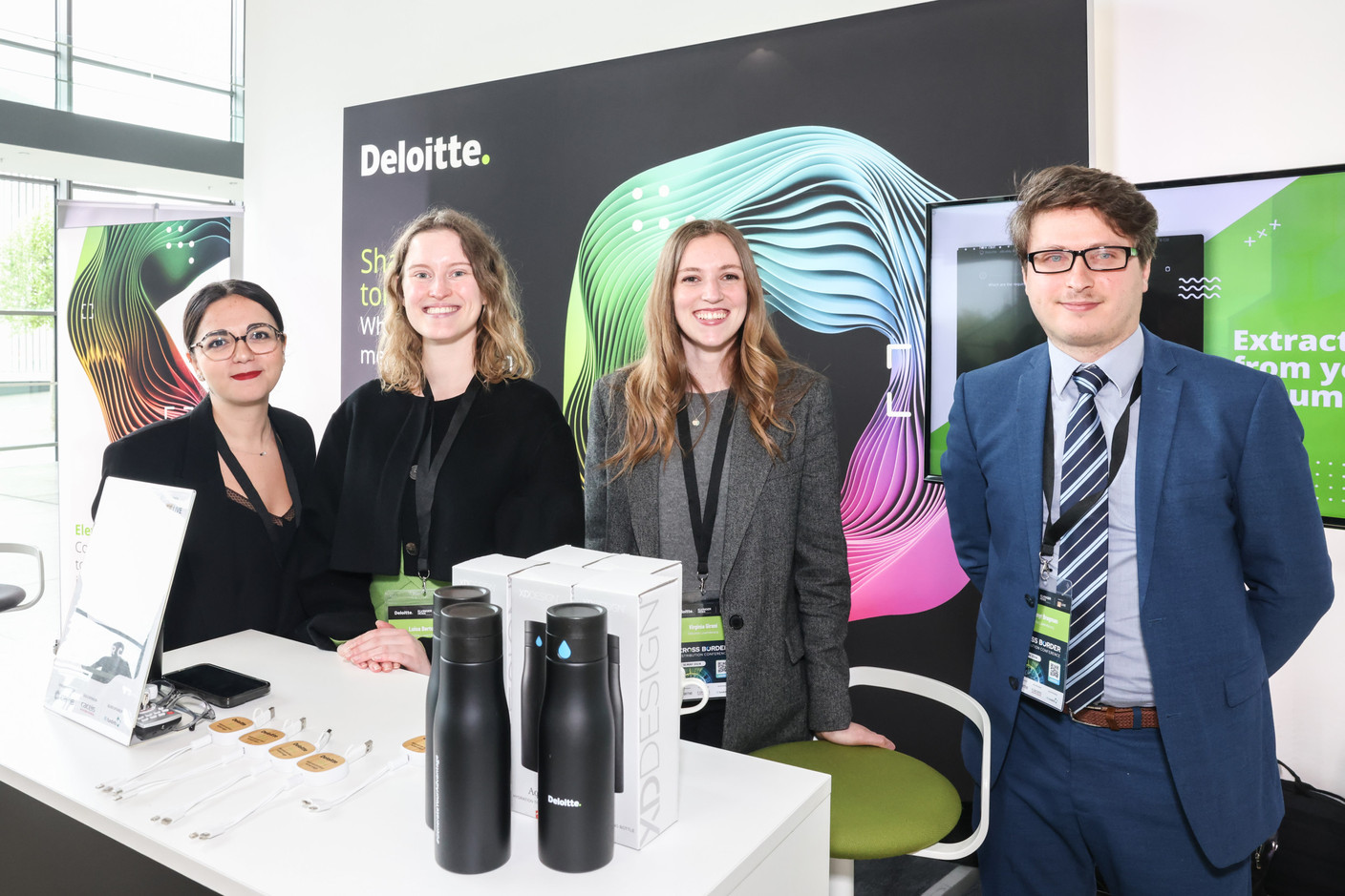 Deloitte staffers Luisa Bertoldi (second from left), Virginia Gironi (second from right) and Liubomyr Bregman (on right) seen attending the Cross-Border Distribution Conference, 16 May 2024. Photo: Marie Russillo/Maison Moderne