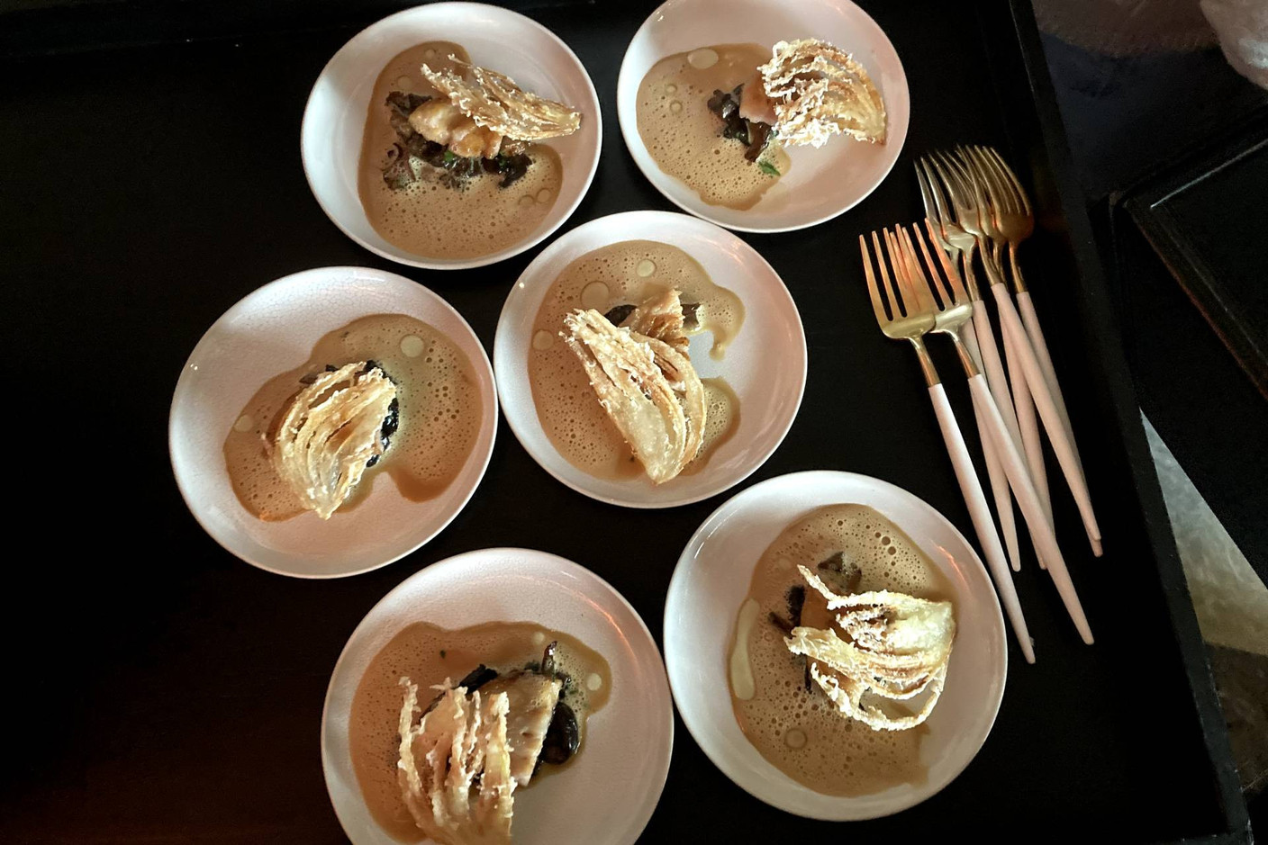 Onion tempura with Iberian pork and wild mushrooms. Photo: Céline Coubray