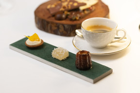 Orange tartlet, apple fruit pâté and a cannelé.  Photo: Guy Wolff/Maison Moderne