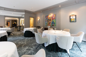 The main dining room has a sober, relaxed contemporary feel. Photo: Guy Wolff/Maison Moderne