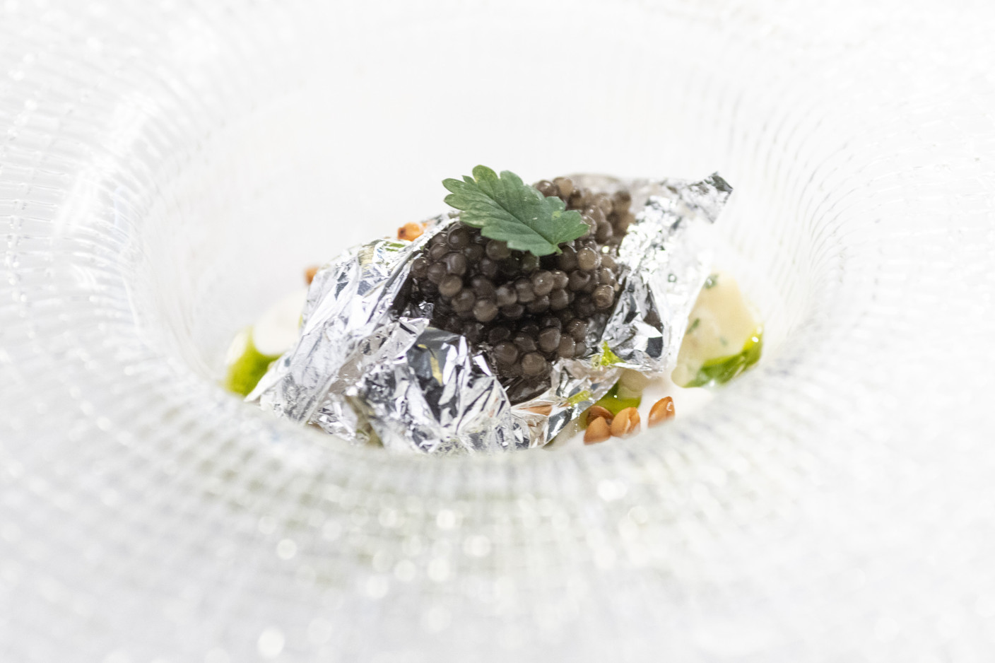 Baked Agria potato accompanied by Royal Belgian Caviar and gribiche sauce. Photo: Guy Wolff/Maison Moderne