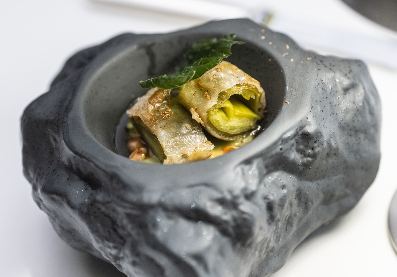 Leeks from Les Paniers de Sandrine, served with hazelnuts and candied lemon.  Photo: Guy Wolff/Maison Moderne