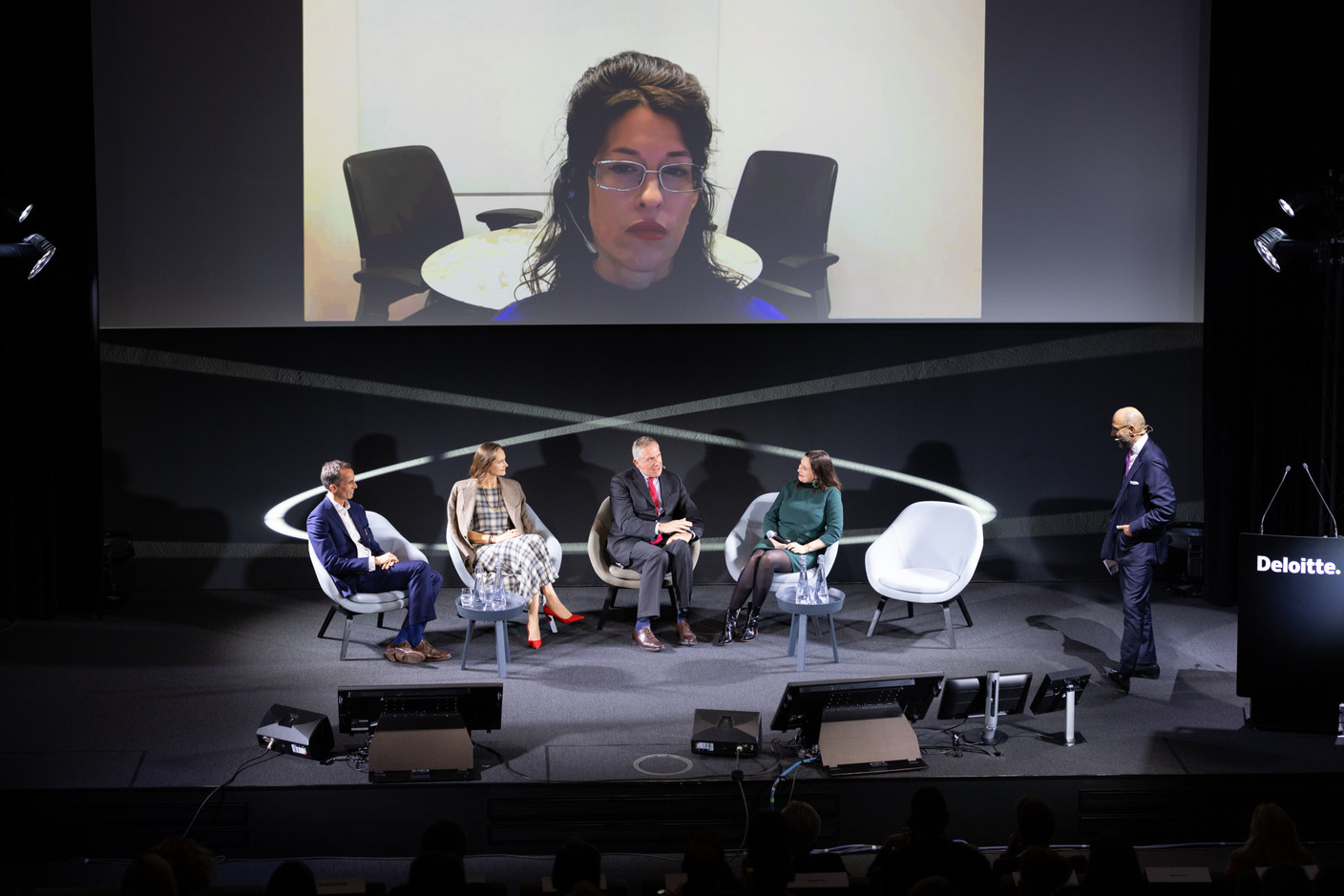 Monica Heslington (Goldman Sachs Family Office), on screen, along with Thomas Galbraith (Barker), Masha Faurschou (Artrium), Italo Carli (Arte Generali Italy) and Sophie Perceval (Wondeur) participated in a panel that focused on family offices' best practices for collection management & opportunities offered by new technologies and fractional ownership during the 15th Deloitte Private Art & Finance Conference, which took place on 21 November 2023. Andrea Circi (Deloitte Italy) was the moderator. Photo: Romain Gamba/Maison Moderne
