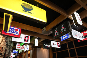 The signs were specially designed for the restaurant. Photo: Marie Russillo/Maison Moderne