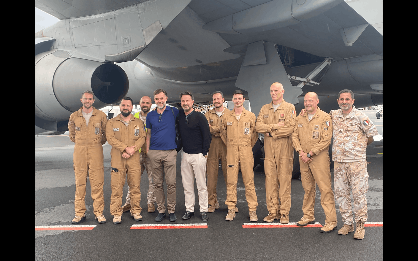 Prime minister Xavier Bettel and minister for development cooperation and humanitarian affairs Franz Fayot and flight crew on arrival  AO