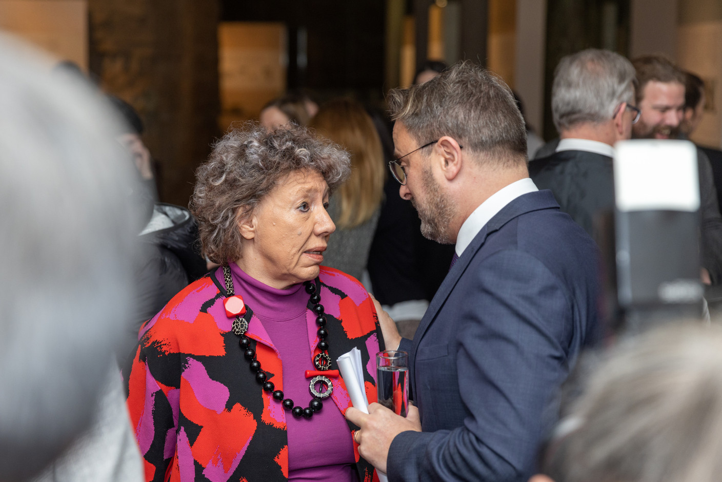 Prime minister Xavier Bettel (r.) speaking with Colette Mart, a retired journalist who worked in Luxembourg’s media for more than three decades. Mart is an alderwoman on the City of Luxembourg council  Photo: Romain Gamba