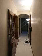 The main corridor in V and S’s prior to renovations. Photo provided by V and S