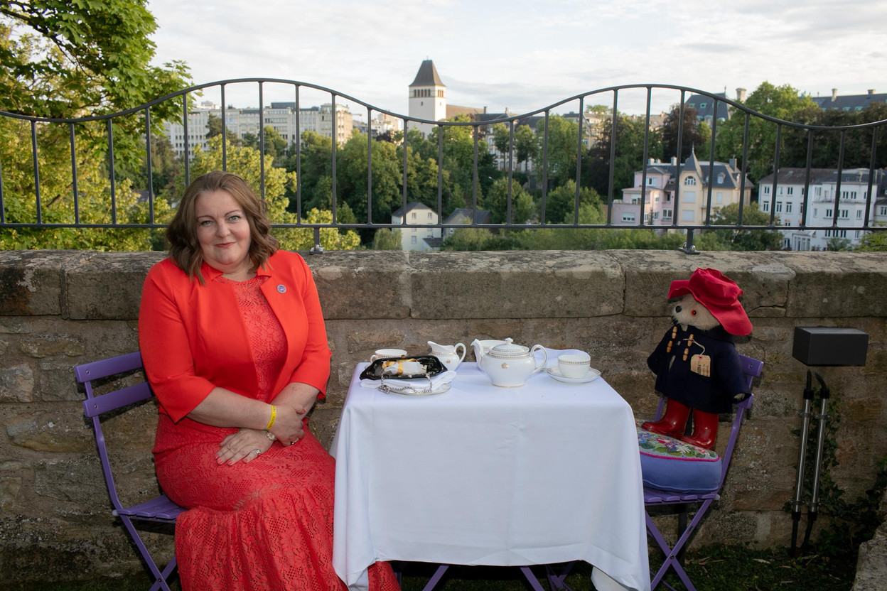 British ambassador Fleur Thomas poses with Paddington bear at the celebrations marking the birthday and platinum jubilee of Queen Elizabeth II.   Matic Zorman/Maison Moderne