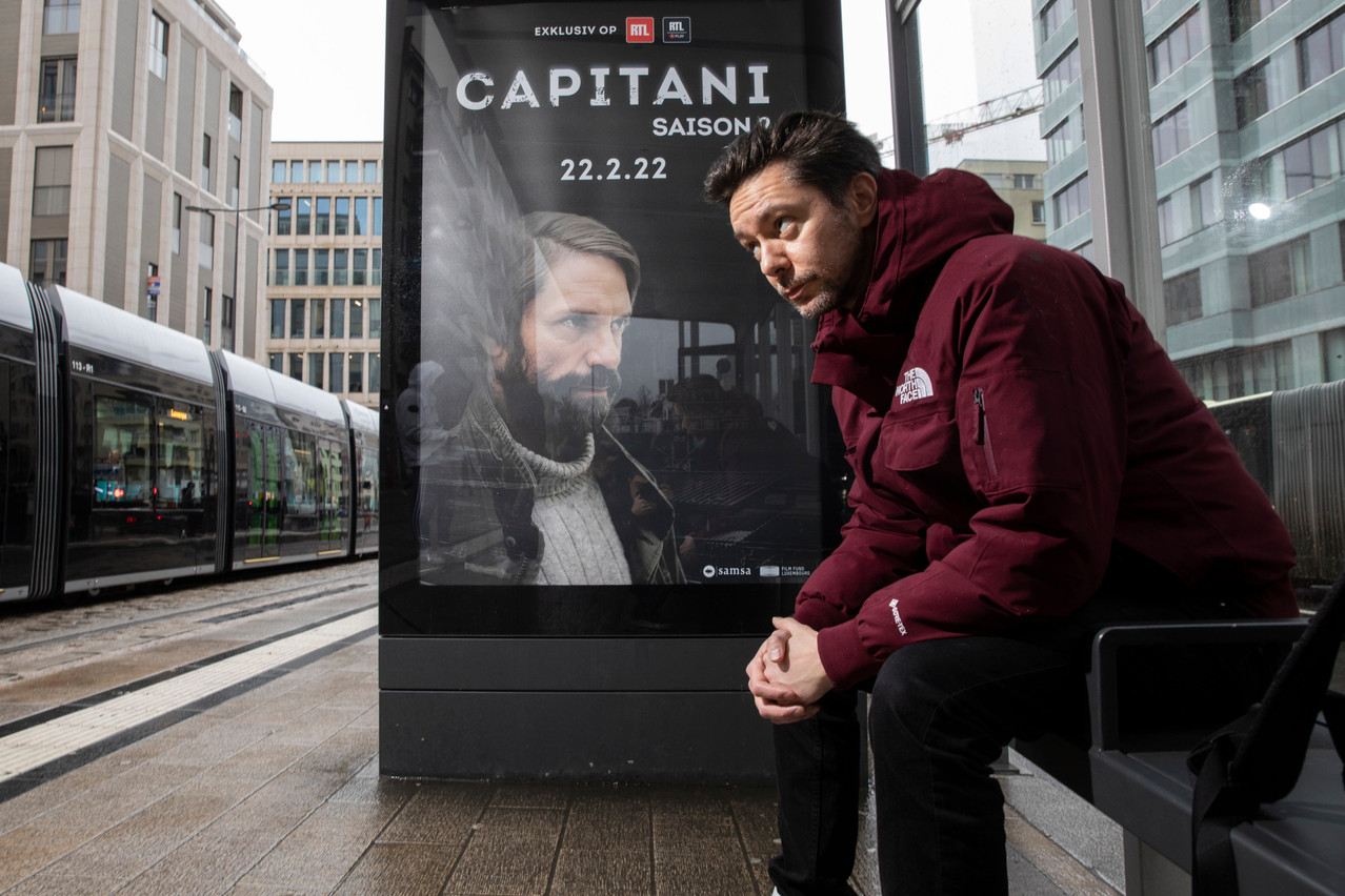 Thierry Faber, creator, showrunner and co-writer of the series Capitani, pictured with a poster ahead of season 2’s release Photo: Guy Wolff/Maison Moderne