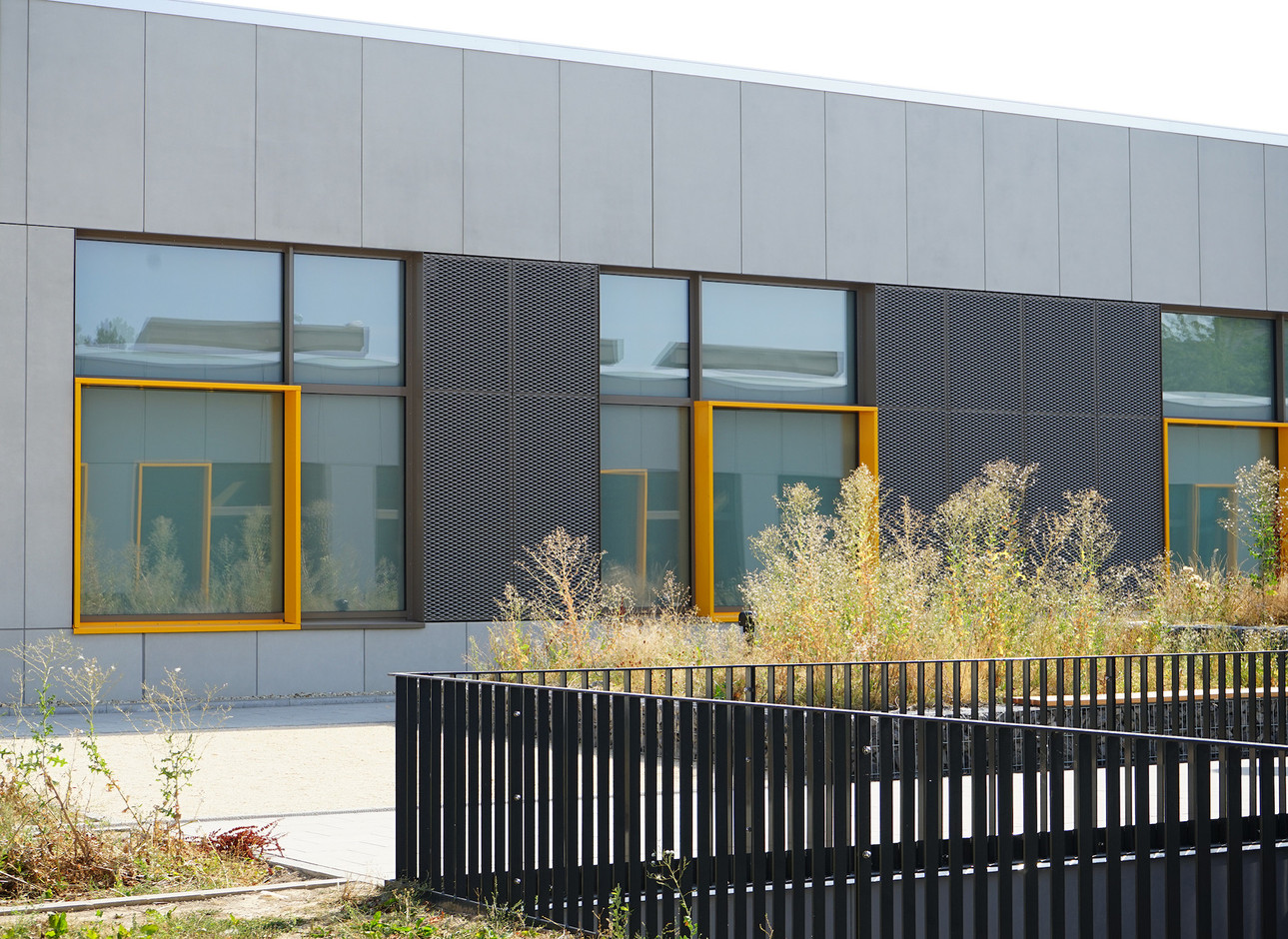 The yellow window frames form a visual signature.                      (Decker, Lammar & Associates)