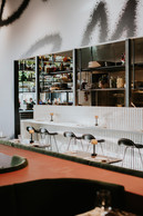 At Specto, diners mingle (work colleagues, family, friends) in an atmosphere that feels as much like a restaurant as it does a living space. (Photo: Anna Katina)
