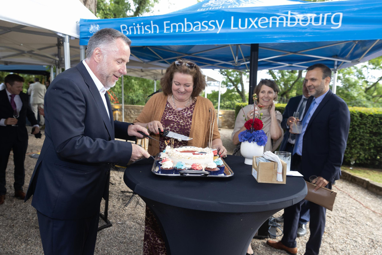 BCC chair Daniel Eischen and British ambassador Fleur Thomas cut the birthday cake watched by BCC office manager Becca Kellagher and embassy deputy head of mission Danial Shaikh.  Guy Wolff/Maison Moderne