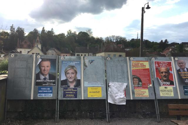 Official French presidential campaign posters are seen in Burgundy on 16 April 2017 Maison Moderne