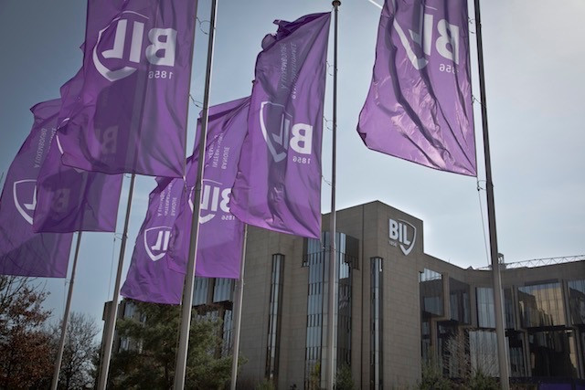 Flags bearing the logo of Banque international à Luxembourg fly in front of the bank’s route d’Esch headquarters in April 2014 Maison Moderne