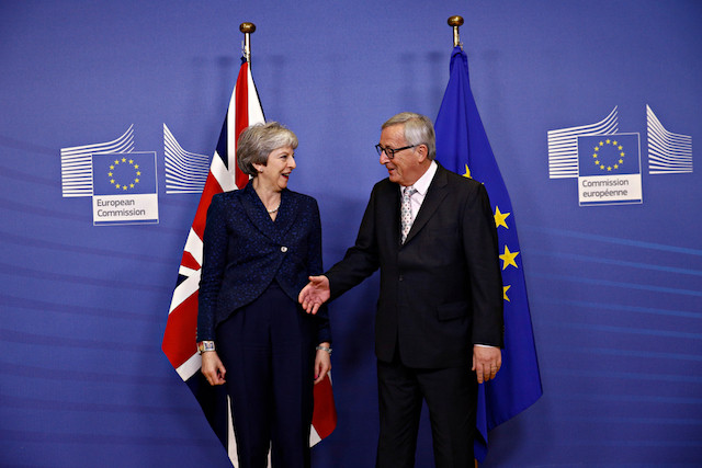 UK Prime Minister Theresa May shakes hands with European Commission President Jean-Claude Juncker in Brussels on 24 November 2018 Shutterstock