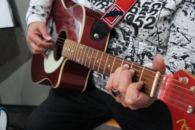 A Creamisu customer plays guitar in the music room Jess Bauldry