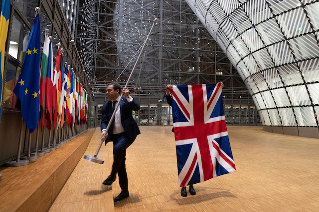 31st January 2020. EU Council staff members arrive to remove the United Kingdom's flag from the European Council building in Brussels on Brexit Day Shutterstock