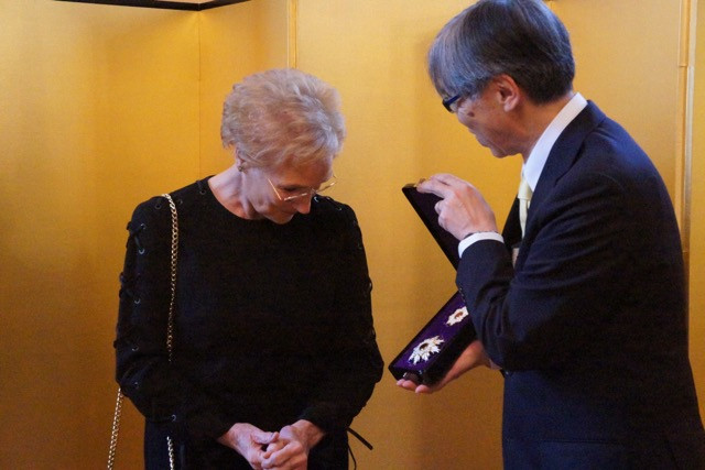 Erna Hennicot-Schoepges is presented with the Order of the Rising Sun Gold and Silver by Japan's ambassador to Luxembourg, Shigeji Suzuki Delano