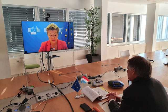 Henri Kox attending the virtual Schengen Forum while European Commissioner for Home Affairs Ylva Johansson is seen on the screen MSI
