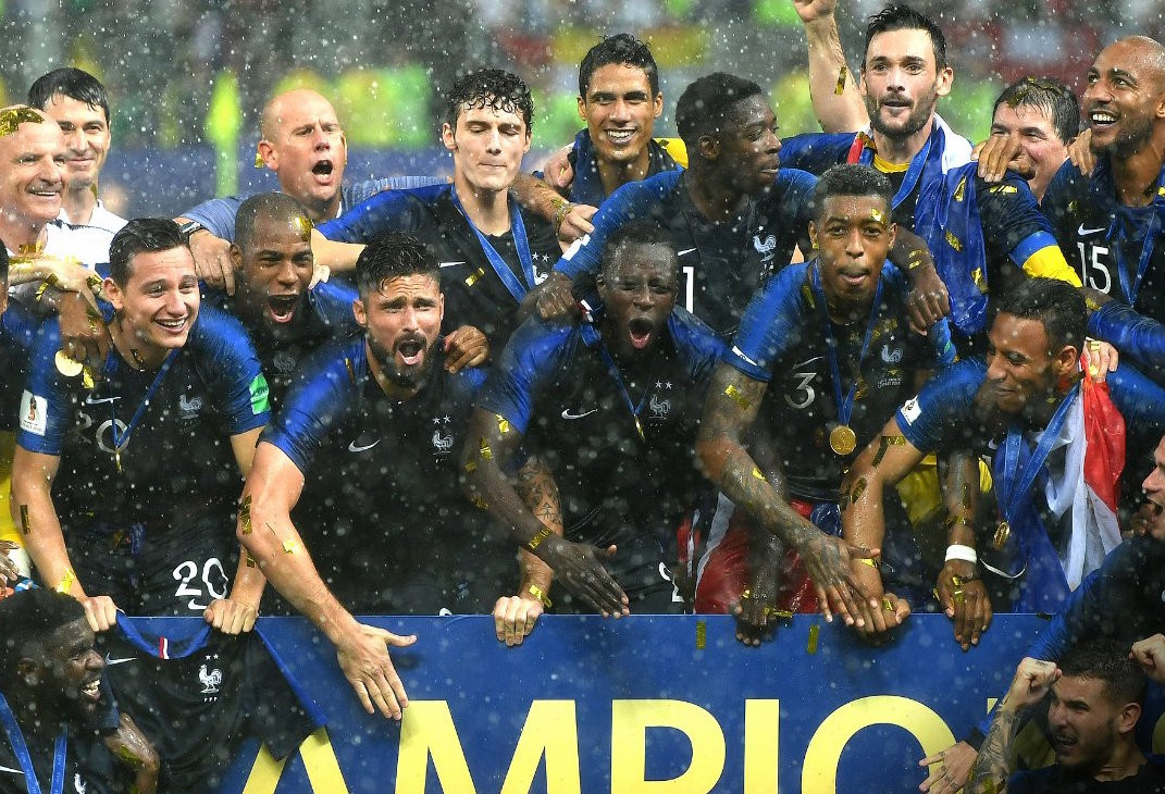 French players are drenched in rain and gold as they celebrate winning the World Cup in Moscow on Sunday FIFA twitter account