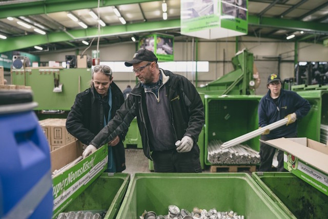 Thomas Hoffman of SuperDreckskëscht (centre) and his colleague inspect recyclable materials during a visit of a SDK recycling centre, which was featured in Delano’s May 2016 print edition. Sven Becker
