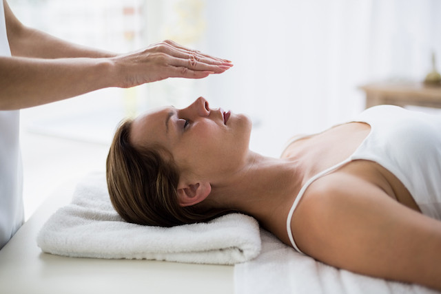 The Welly platform aims to demystify holistic treatments such as reiki, pictured here Shutterstock