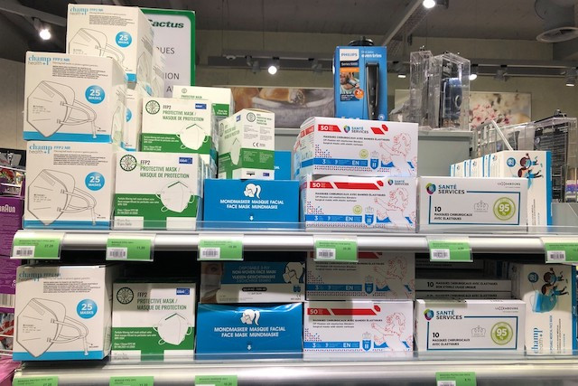 On the left, protective masks. In the middle, the blue box contains “barrier” masks, which have the same shape as the surgical ones to their right but at half the price.  Maison Moderne