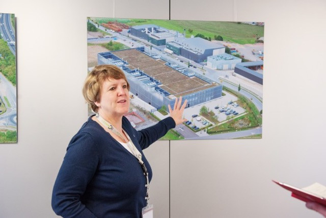 Christine De Ridder of LuxConnect with an aerial photo of the firm’s three Bettembourg data centres. She is pictured giving a tour to Delano on 3 April 2017. LaLa La Photo