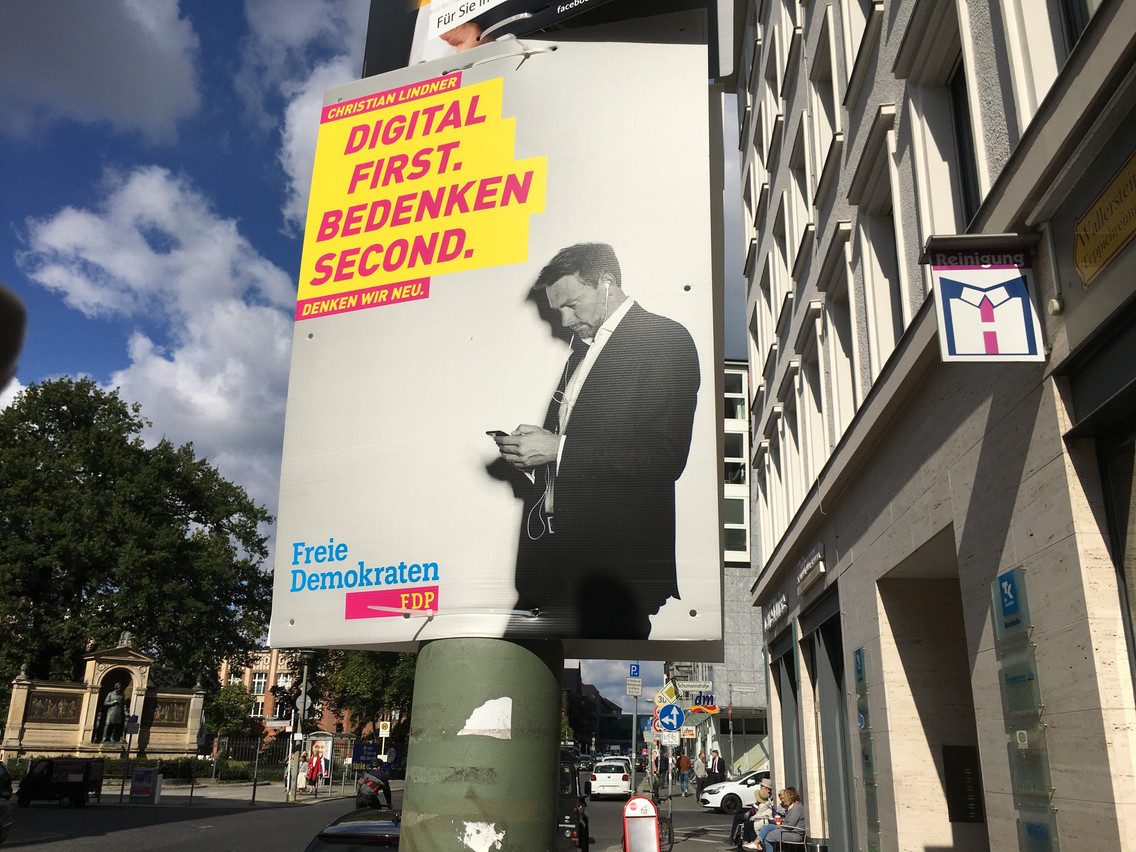 Merkel needs to negotiate first with the CSU before calling on the FDP and the Greens on a possible coalition agreement.Pictured: a campaign poster of the FDP: "digital first. thinking second." Martine Huberty