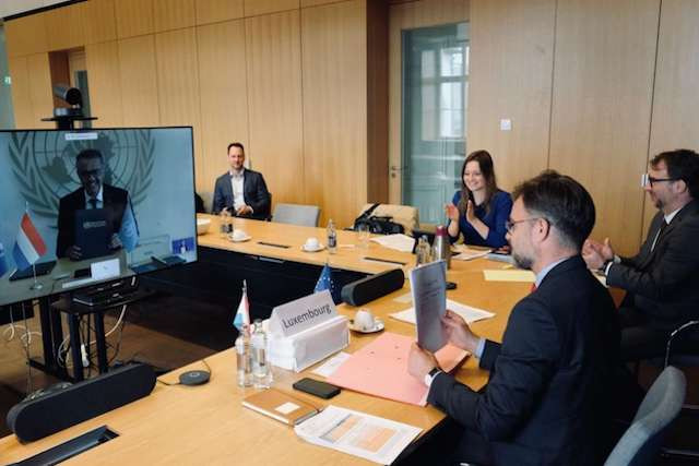 Luxembourg Cooperation and humanitarian action minister Franz Fayot is pictured, bottom right, speaking via video conference with WHO director general Tedros Adhanom Ghebreyesus on 18 June Luxembourg Government
