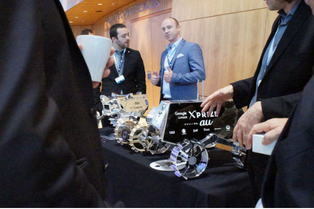Ispace Europe managing director Kyle Acierno is seen standing next to a model of the micro-rover at the new space conference held in Luxembourg on 16 November 2017 Delano