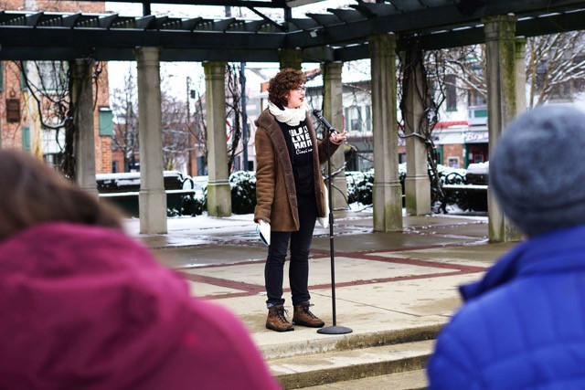 Magda Orlander, at the time a student at Miami University, addresses fellow students and community members at the Unity Day March in Oxford, Ohio, on 4 March 2017. She is performing a spoken word piece about the November 2016 US election. Ryan Terhune