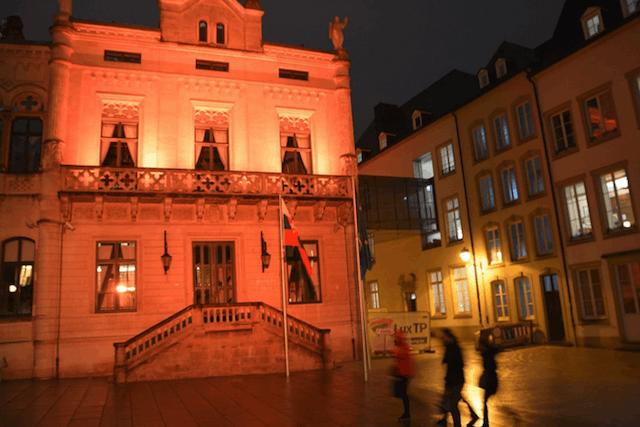 The Chamber of Deputies in the rue due Marché-aux-Herbes is shown lit up in orange for the weeklong awareness-raising campaign Facebook/Chambre des Députés