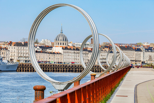 A view of Nantes with installation The Rings by Daniel Buren and Patrick Bouchain, and Maille BrezeNante, a French destroyer. Nantes is one of three new destinations Luxair will fly to in 2020. Shutterstock
