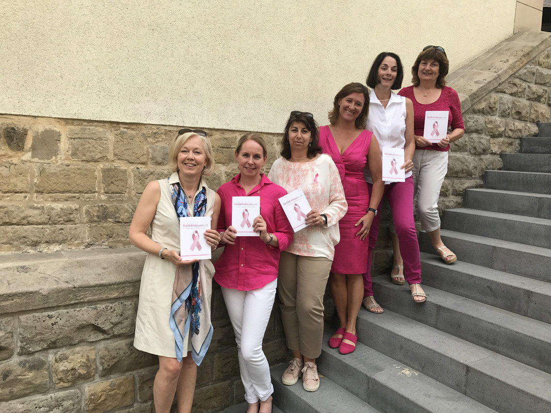 Think Pink Lux committee members show off the booklet. Pictured from left: Nicolette Sutherland, Carrie Cannon, Helen Cope, Nicola Vickers, Margot Parra and Freda Deed Delano