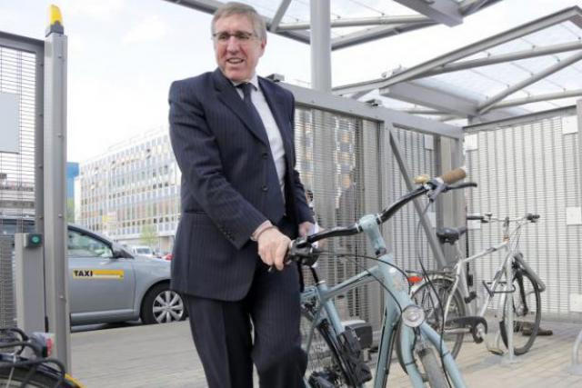 More mBoxes will be installed at train stations across the country soon. Pictured: François Bausch, the instructure minister, parks a bike at the central train station in April 2014. Luc Deflorenne