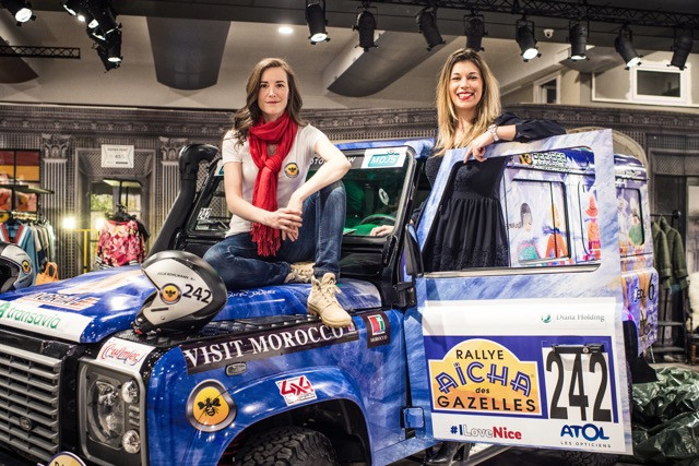 Julie Kohlmann and Elodie Baudin pose for a photo on Julie's Land Rover Defender at their farewell party hosted at the Robin du Lac Concept Store on route d'Esch on 14 March Mike Zenari