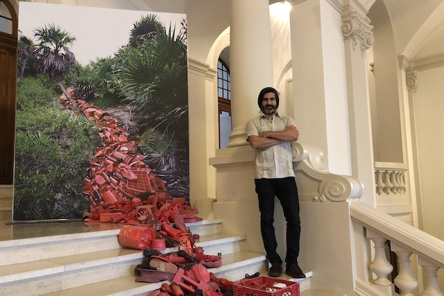 Alejandro Durán posing in front of his installation at the Cercle Cité on Thursday Delano staff
