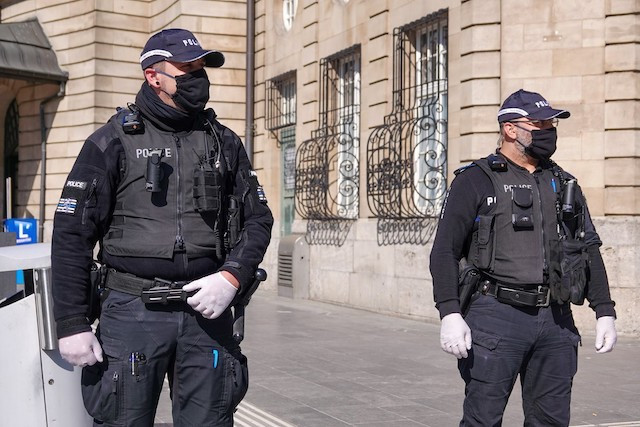 Photo shows Luxembourg police officers wearing masks in front of the train station in Luxembourg City Luxembourg Police