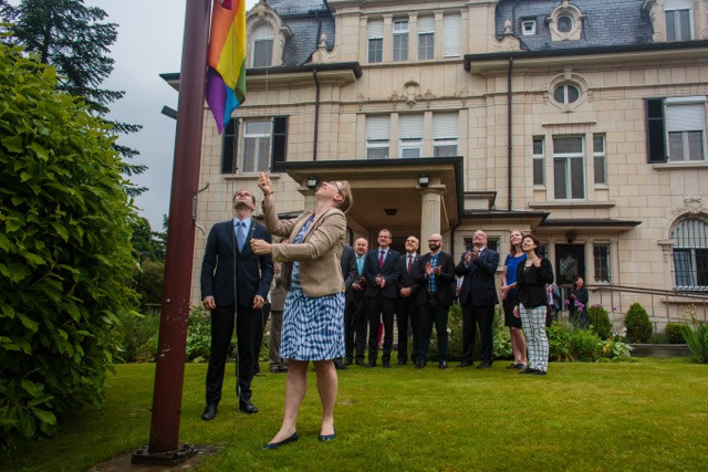 US Chargé d'Affaires Kerri Hannan and first husband Gauthier Destenay raise the rainbow flag in the grounds of the US embassy Matic Zorman