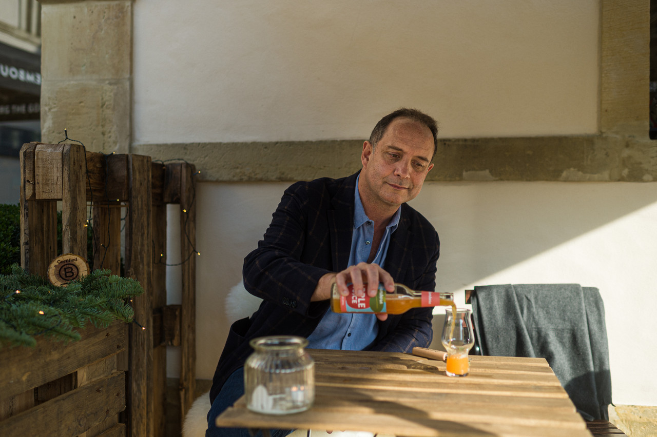Ramborn founder Carlo Hein enjoying an apple juice near the orchards in Born Mike Zenari