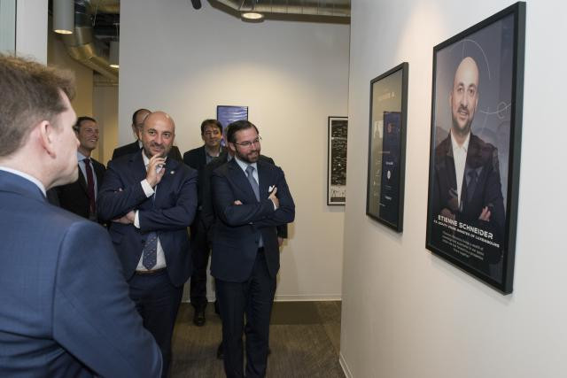 Crown Prince Guillaume (centre) looks at a picture of Étienne Schneider, Luxembourg’s deputy prime minister and economy minister, during a visit to the offices of Planetary Resources, in the Seattle region, on 10 April 2017 SIP/Jean-Christophe Verhaegen