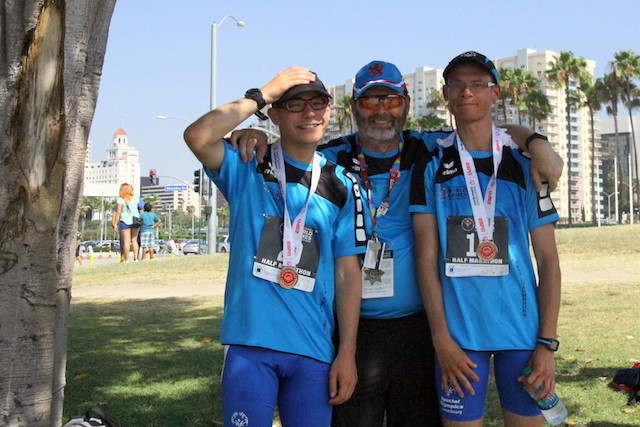 Half marathon runners Eike Schröder (left) and Ronny Kontz (right) are seen with their Special Olympics coach, Pierrot Feltgen, during the 2015 Special Olympics World Summer Games in Los Angeles Special Olympics Luxembourg