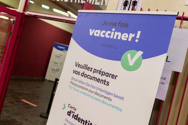 An information banner is pictured at the country's first vaccination centre at Hall Victor Hugo on 28 December 2020 Emmanuel Claude