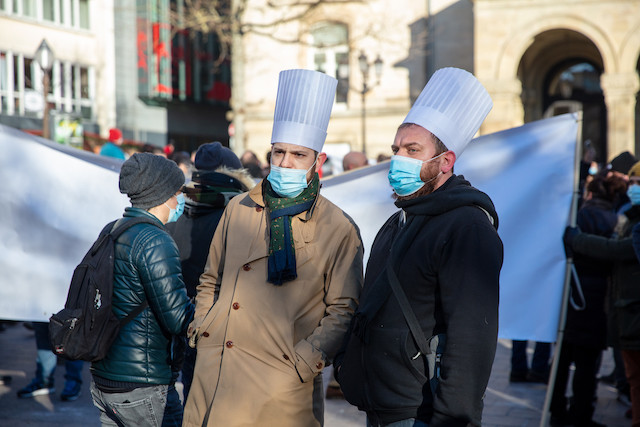 February 2021 archive photo shows two chefs in toques attending a demonstration by the hotel and restauration sector calling for an end to the forced sector shutdown Roman Gamba