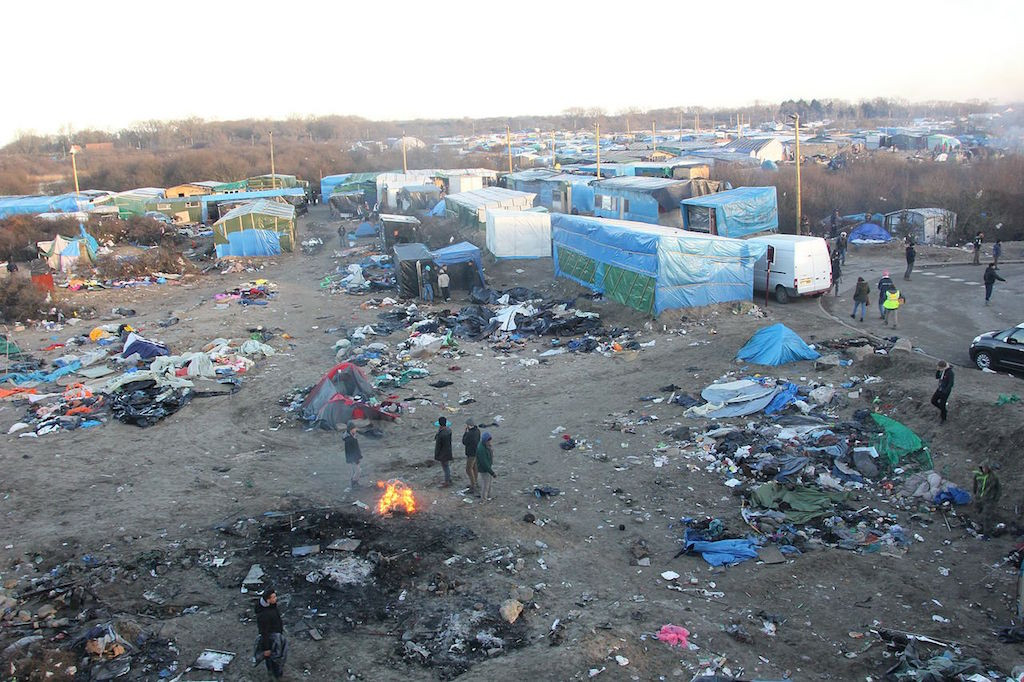 The Jungle refugee camp outside Calais where “repeated prolonged” gatherings were banned by the city’s mayor, effectively making food distribution illegal. Malachybrowne/Flickr