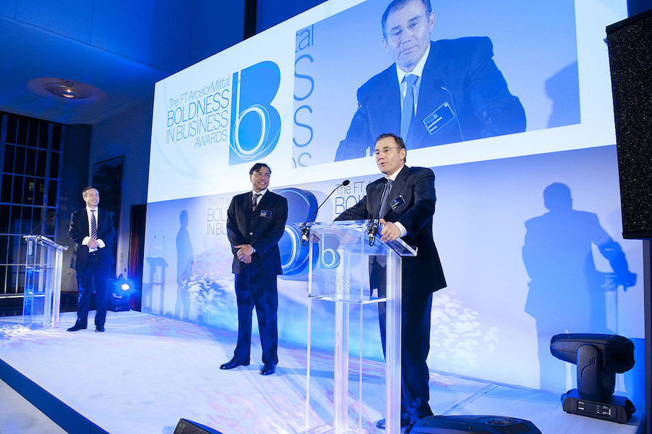 Glencore CEO Ivan Glasenberg is presented with the Person of the Year award by Lakshmi Mittal at the 2013 FT ArcelorMittal Boldness in Business Award ceremony FT flickr account